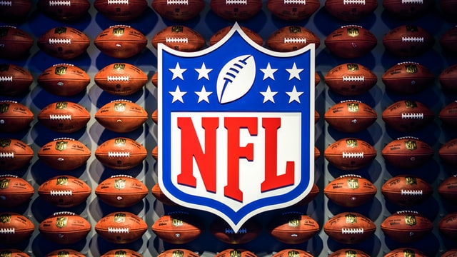 NFL sign and American footballs