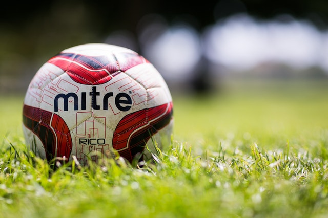 White soccer ball on grass