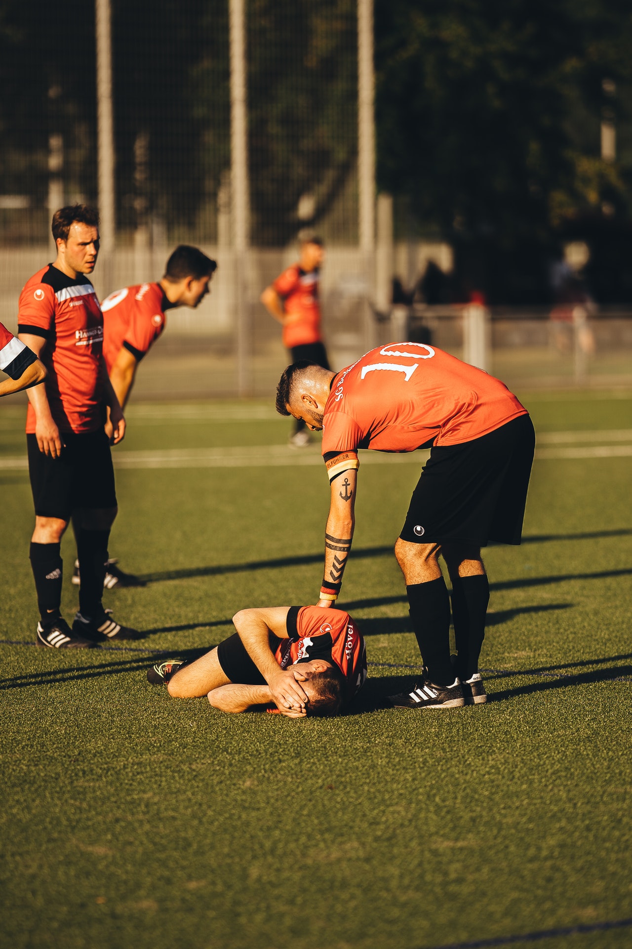 Injured soccer player lying on the ground
