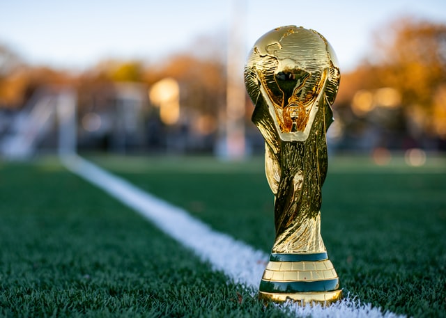 Replica World Cup trophy on grass pitch